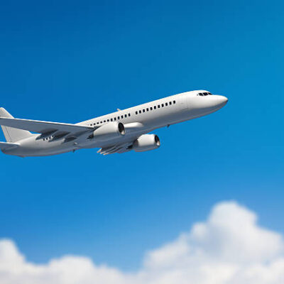 Passanger airplane flying above clouds.