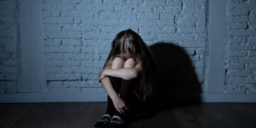 Sad desperate young girl suffering from bulling and harassment at school