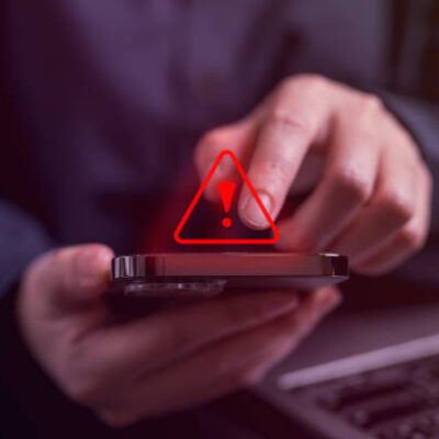 People with warning notification and spam message icon on mobile phone, Spam link on smartphone, Virus on smartphone, Alert warning scam, Hacker