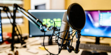 Microphone and mixer at the radio station studio broadcasting news