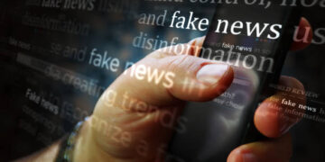Social media on display with fake news and hoax information. Searching on tablet, pad, phone or smartphone screen in hand. Abstract concept of news titles broadcasting 3d illustration.