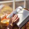 Teenage girl enjoying reading a book on windowsill. Sunny summer day.
Shot with Canon R5