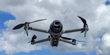 DJI Mavic 4 Pro drone flying in the air with the Hasselblad gimbal camera pointing forward. The Mavic 3 is a teleoperated quadcopter drone for aerial photography and videography mad by Chinese manufacturer DJI.