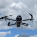 DJI Mavic 4 Pro drone flying in the air with the Hasselblad gimbal camera pointing forward. The Mavic 3 is a teleoperated quadcopter drone for aerial photography and videography mad by Chinese manufacturer DJI.