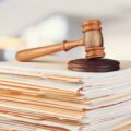 Judge hammer and documents on  background