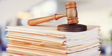 Judge hammer and documents on  background