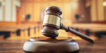 Judges gavel in court room legal trial and law background